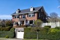 dwelling with garage and plants around the building, real estate