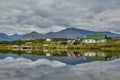 Dwelling of meteorologists on island. Reflexion in water. Jack London's lake. Kolyma Royalty Free Stock Photo