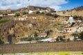 Dwellings houses into rock at Puerto Lumbreras and castle Royalty Free Stock Photo