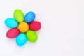 Dyed easter eggs flower on white background with copy space