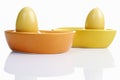 Dyed Ester eggs in colorful ceramic egg cups Royalty Free Stock Photo