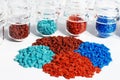 Dyed plastic granulate in test glasses Royalty Free Stock Photo