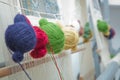 Various yarn on weaving handmade carpet . manual production of carpets .round wooll yarn . ball wooll . Dyed Threads to be Used Royalty Free Stock Photo