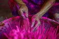 Dyeing and sun-drying pink incense sticks, creating a colorful visual effect.