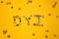 DYI abbreviation made of gears on yellow background.