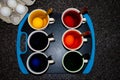 Dying Easter eggs with coffee cups and spoons