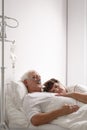 Dying husband in hospital bed Royalty Free Stock Photo