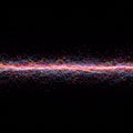 Dynamic array of colorful, intertwining light trails on a black background. The lines are Royalty Free Stock Photo