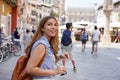 Dynamic attractive traveler girl visits Italy with friends. Beautiful young tourist woman doing a quick tour of Europe in company