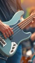 Dynamic bassist performs on stage, hands expertly maneuver electric guitar