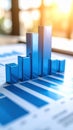 Dynamic blue 3D bar chart showing upward growth on a financial report document data analysis concept Royalty Free Stock Photo