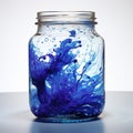 Dynamic Blue Ink Splash in Transparent Glass Container