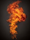 Dynamic bright orange and yellow flames twisting upward with dark smoky background creating an intense and dramatic fiery visual Royalty Free Stock Photo
