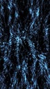 Dynamic burst of blue glowing particles creating a star-like explosion pattern on a deep black background Royalty Free Stock Photo