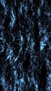 Dynamic burst of blue glowing particles creating a star-like explosion pattern on a deep black background Royalty Free Stock Photo