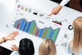 Dynamic Business Meeting with Diverse Team Analyzing Graphs, Charts, and Data for Strategic Planning and Decision Making Royalty Free Stock Photo