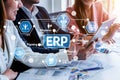 Professionals Collaborating on Enterprise Resource Planning Strategy with Data Visualization and Modern Technology in a Royalty Free Stock Photo