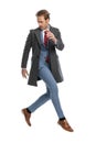 Dynamic businessman with jacket looking to side and jumping Royalty Free Stock Photo