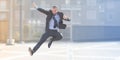 Dynamic businessman jumping outdoor Royalty Free Stock Photo