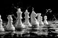 Dynamic capture of chess pieces splashing in water against a dark background Royalty Free Stock Photo