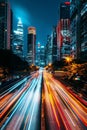 Dynamic city traffic fast cars on illuminated highway at night with light trails in transit Royalty Free Stock Photo