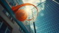 Dynamic close-up of a basketball scoring a basket, set against a backdrop of urban high-rise buildings and a clear sky