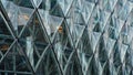 Dynamic close-up of a modern building\'s glass facade, featuring a captivating geometric pattern of triangles. Royalty Free Stock Photo