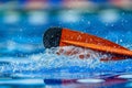 Dynamic close up of oar creating splashes in water, capturing summer olympic games sport action