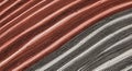 Close-up diagonal striped pattern in red black and white creating abstract texture with dimensional depth from top-down Royalty Free Stock Photo
