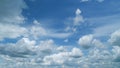 Dynamic cloud time-lapse from calm blue skies to cloudy. Puffy fluffy white clouds. Timelapse.