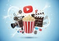 Dynamic collage of film and video elements including popcorn camera clapperboard and youtube icon symbolizing entertainment and Royalty Free Stock Photo