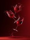 Dynamic Collision of Red Wine Glasses with Vivid Splashes Against Dark Red Background Royalty Free Stock Photo