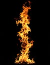 Dynamic Column of Blazing Orange and Yellow Fire Isolated on Pure Black Background Creates Striking Vertical Royalty Free Stock Photo