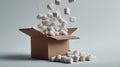 Dynamic composition of packing peanuts frozen in motion as they pour from cardboard box Royalty Free Stock Photo