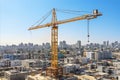 Dynamic construction scene. construction crane building process at unfinished tall structure Royalty Free Stock Photo