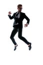 Dynamic cool young man in black suit leaping up Royalty Free Stock Photo