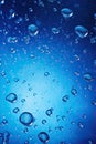 Dynamic deep blue background enhanced by sparkling water droplets and gradients