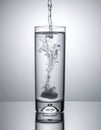 Dynamic Dissolution in a Glass of Water Royalty Free Stock Photo