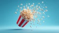 Dynamic explosion of popcorn from a red and white striped bucket on a blue background Royalty Free Stock Photo