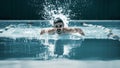 Dynamic and fit swimmer in cap breathing performing the butterfly stroke Royalty Free Stock Photo