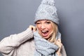 Dynamic flirting young woman winking for fun winter attitude