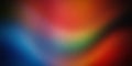 A dynamic gradient with rich shades of red, blue, green, and orange, blending seamlessly to create a vibrant and energetic