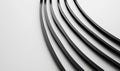 Dynamic grayscale image featuring black curved bars on a white background creating modern aesthetic.