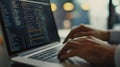 Dynamic hands engaged in coding a close-up of a developer typing on a laptop keyboard with complex code on screen