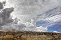 Dynamic HDR photo of cloudy skies and sun behind the clouds and historic city Valletta