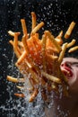 Dynamic High Speed Photography of Person with Mouth Open Catching Flying French Fries Amidst Splashing Water