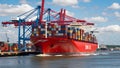 Red Powerhouse: Container Ship Dominates Global Trade Ports Royalty Free Stock Photo