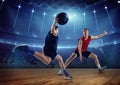 Dynamic image of competitive male athletes, basketball players in motion, dribbling ball during game on 3D arena