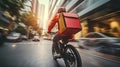 Delivery rider speeding through urban traffic with red insulated backpack Royalty Free Stock Photo