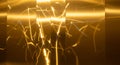 Dynamic light streaks dancing on polished brass metal Royalty Free Stock Photo